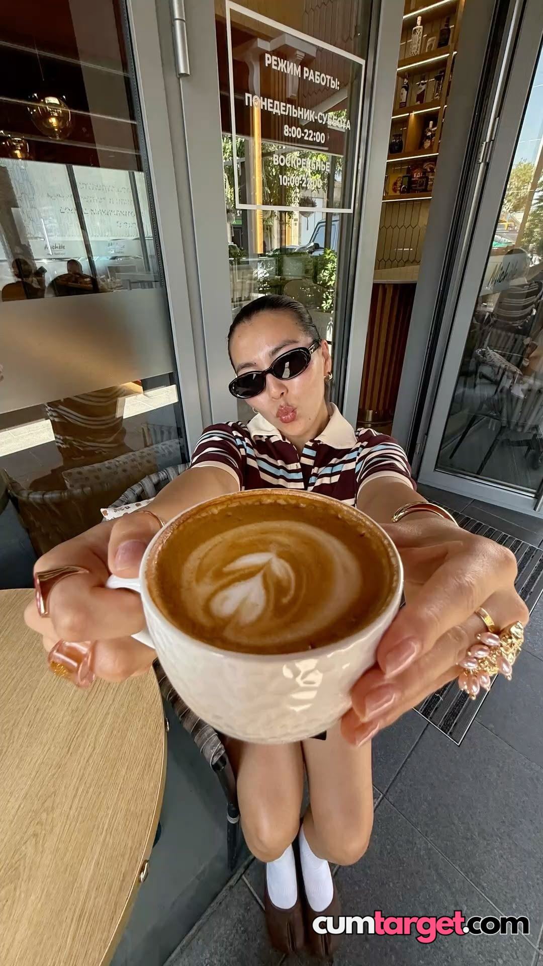 Spray on Woman Offering Coffee Cup