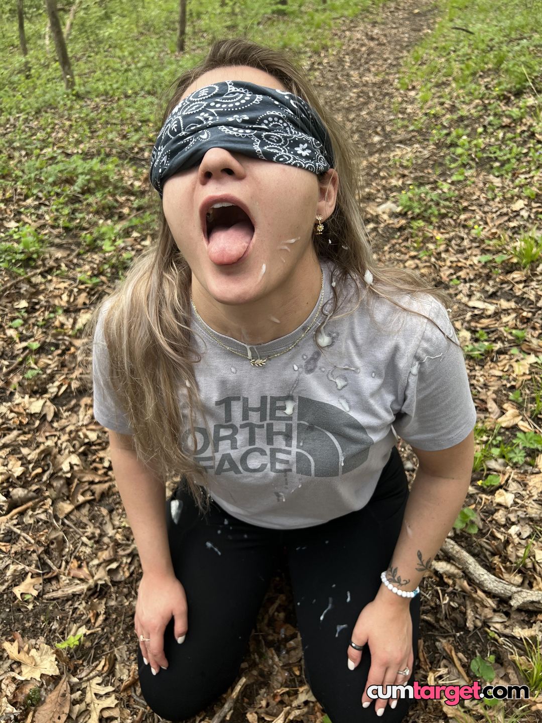 Spray on Blindfolded Woman Outdoors