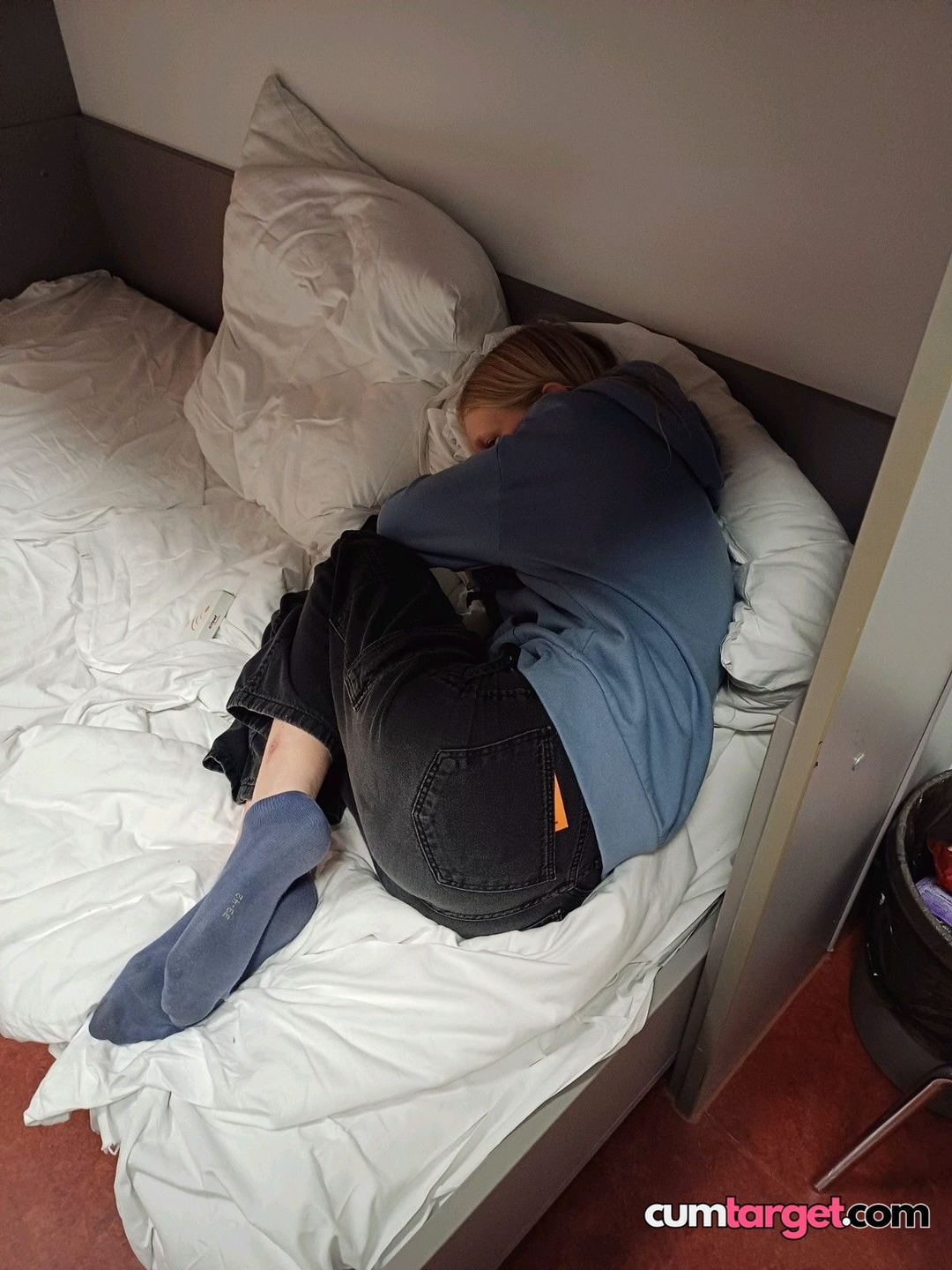 Target Person Curled Up on Bed