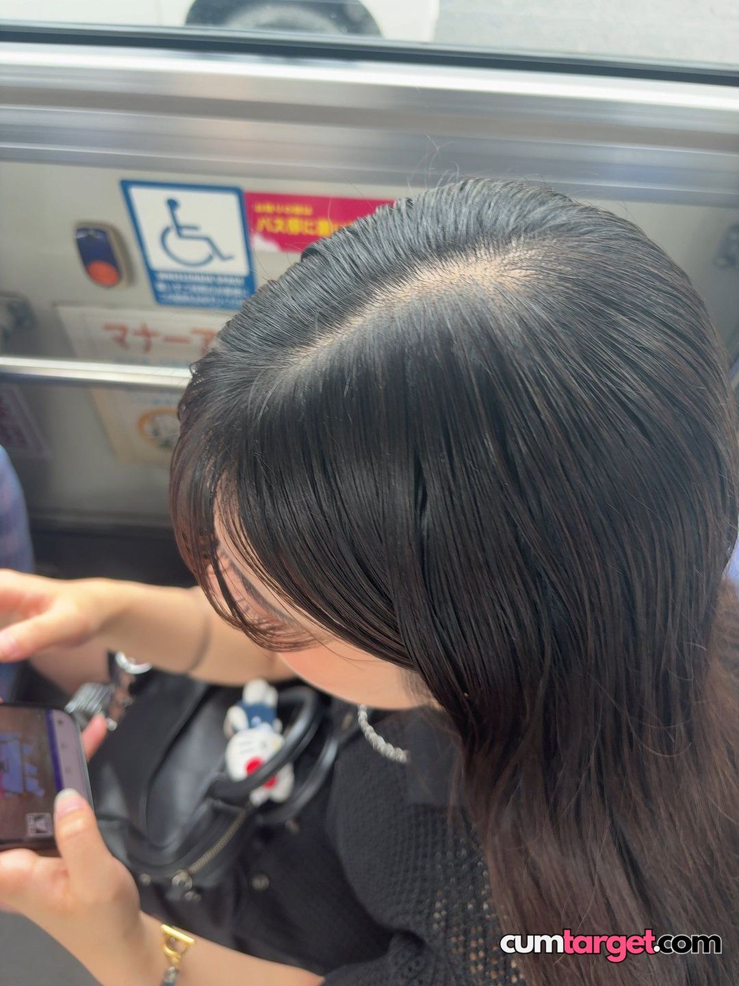 Target Woman Using Phone on Bus