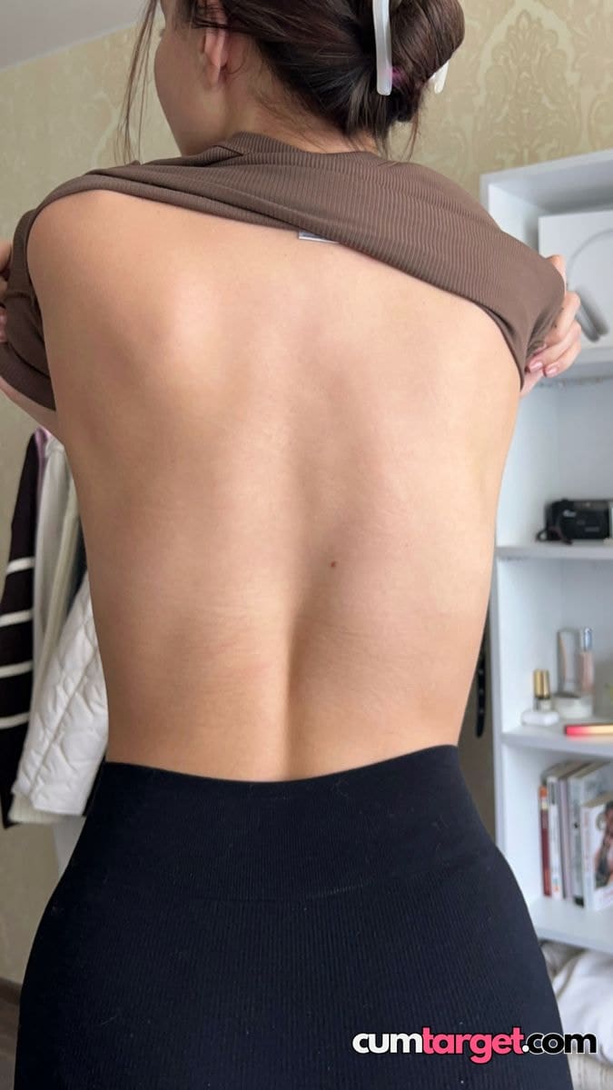 Spray on Woman Lifting Shirt Showing Back