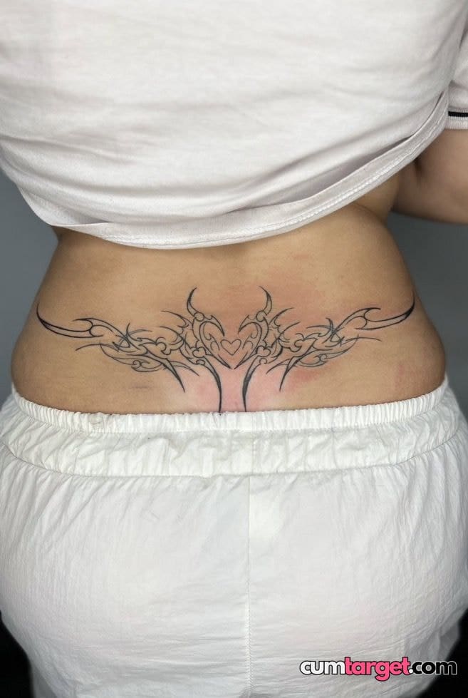 Waiting for Cum Lower Back Tribal Tattoo