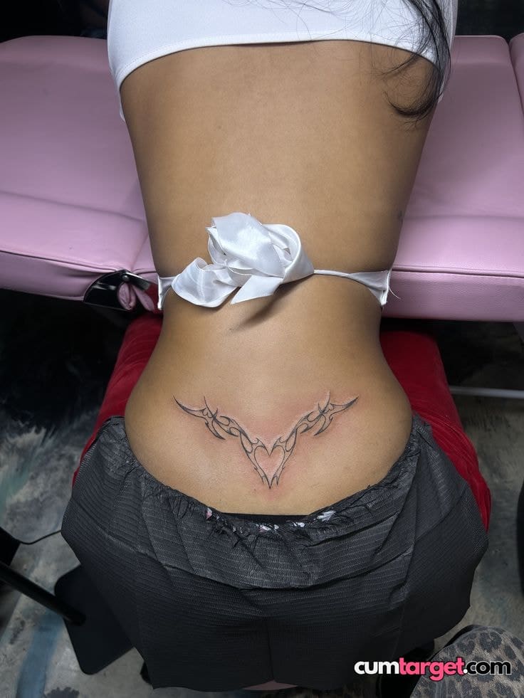 Cum On Lower Back Tribal Tattoo