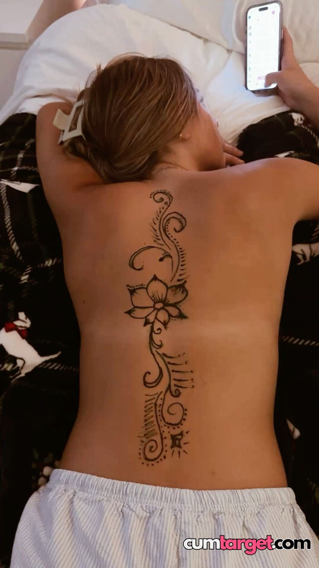 Spray on Relaxing with Phone and Tattoo