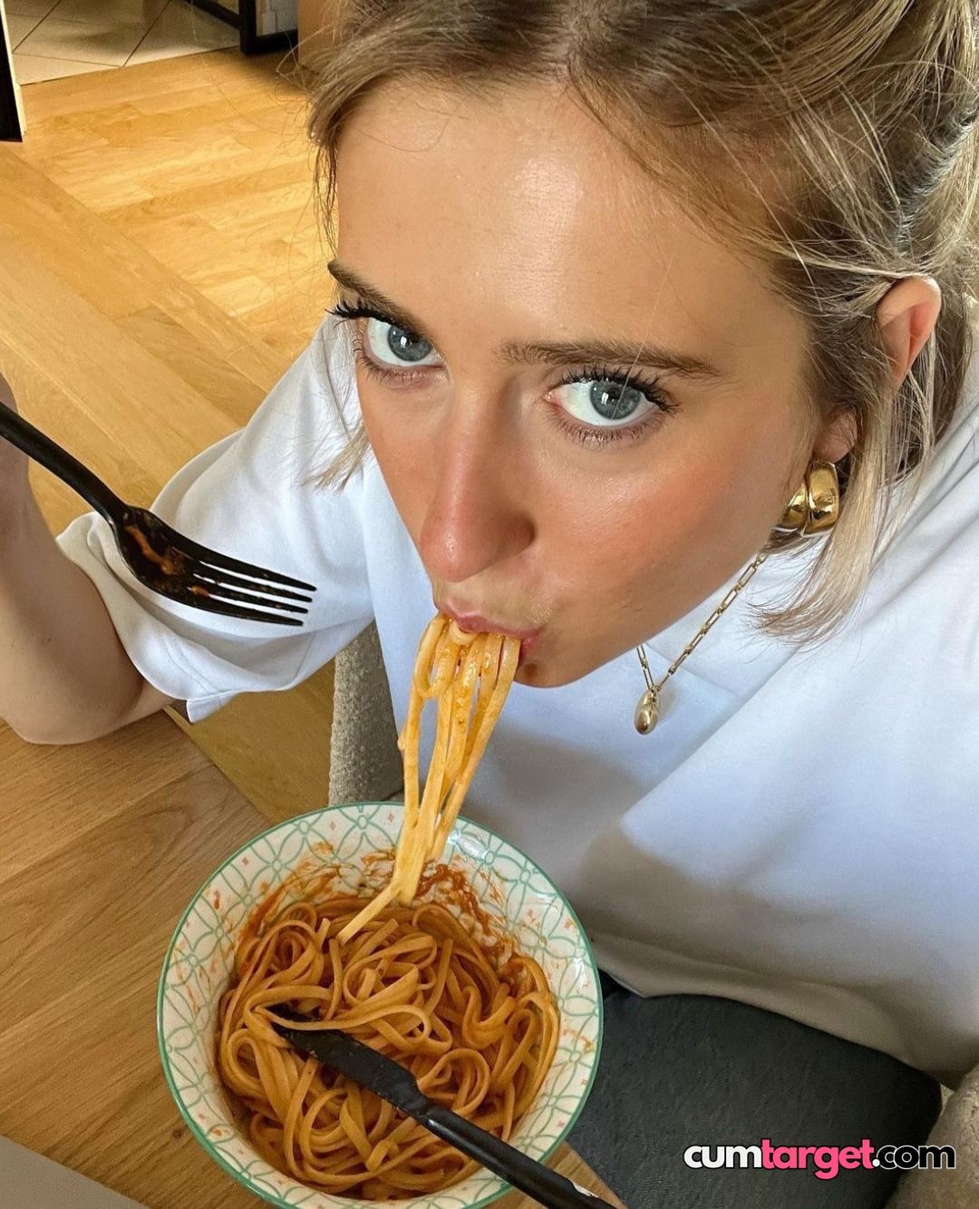 Spray on Woman Eating Spaghetti