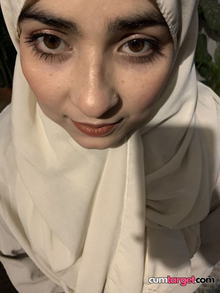 Spray on Close-up Woman in White Hijab