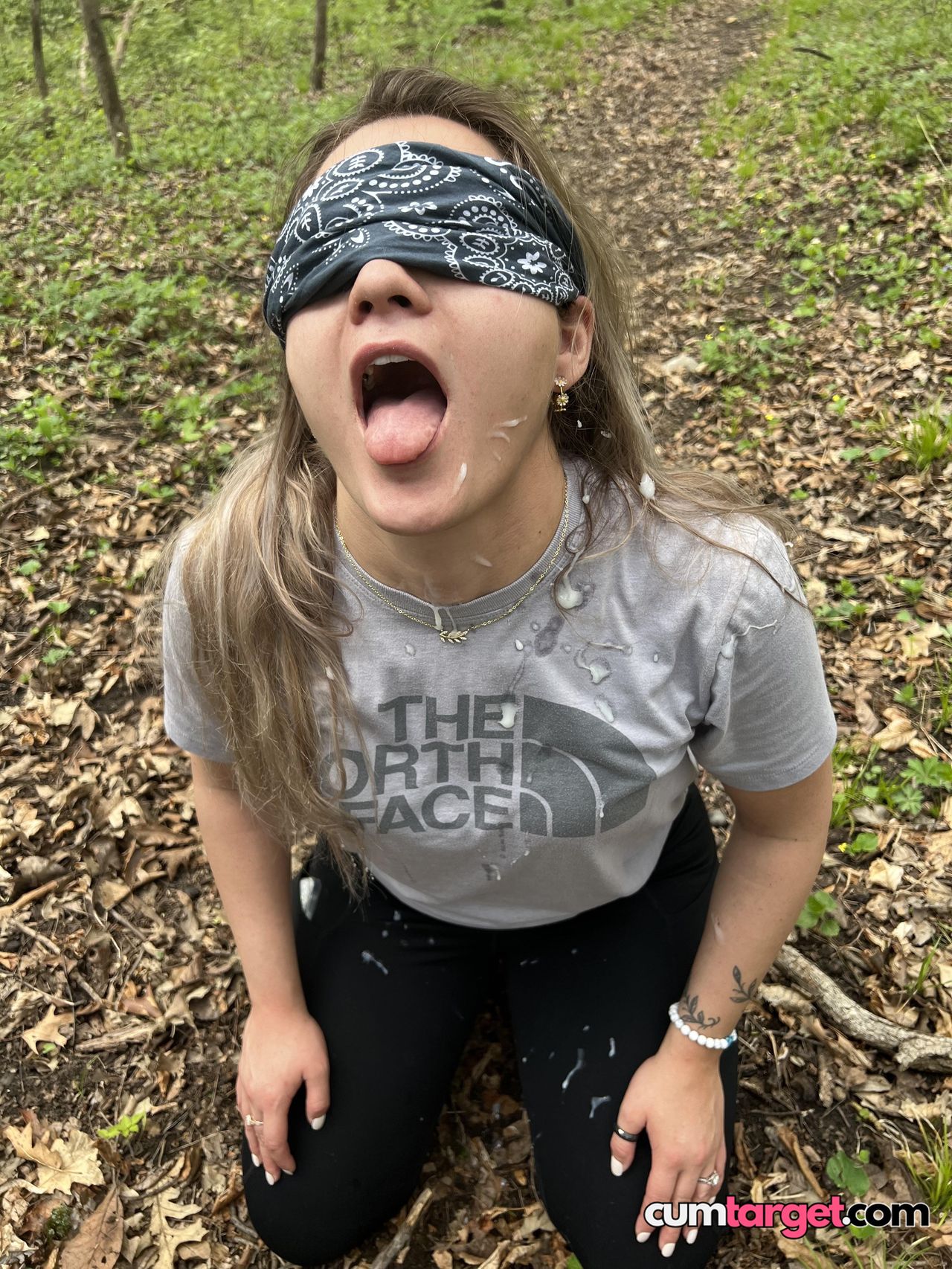 Spray on Blindfolded Woman Outdoors