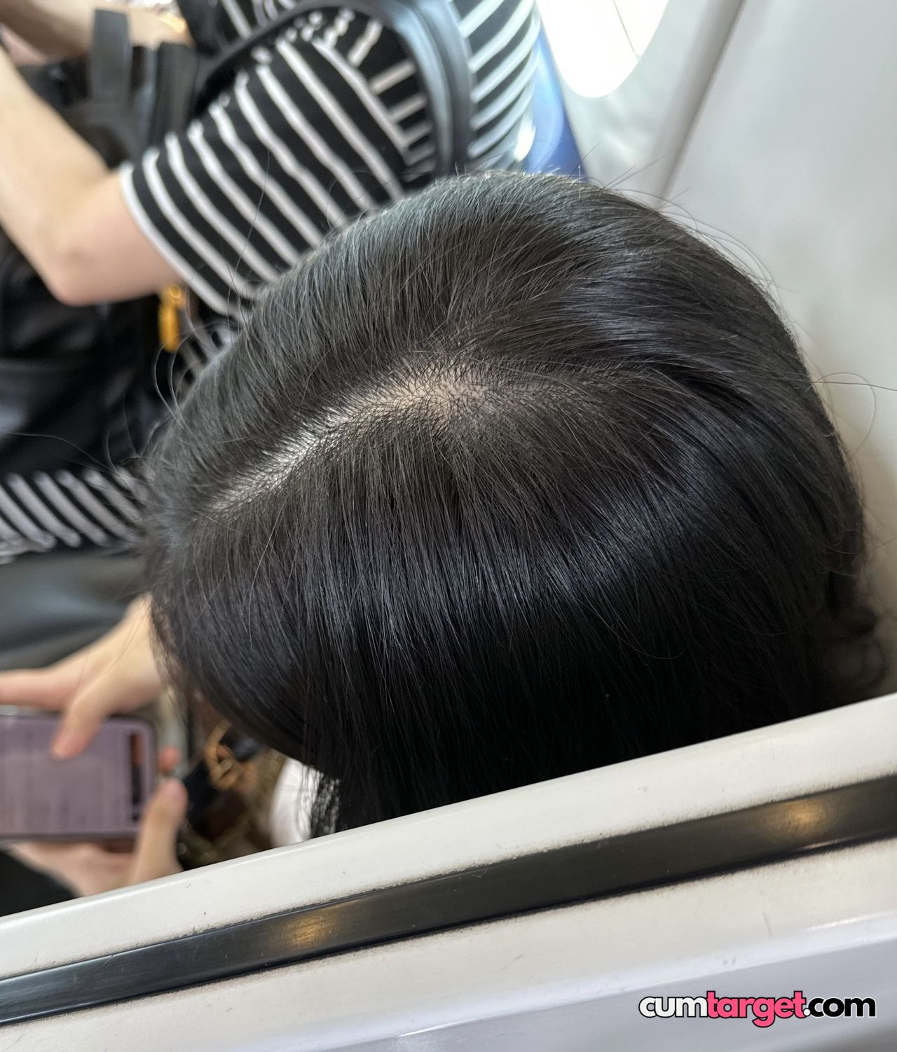 Target Person Using Phone on Public Transport