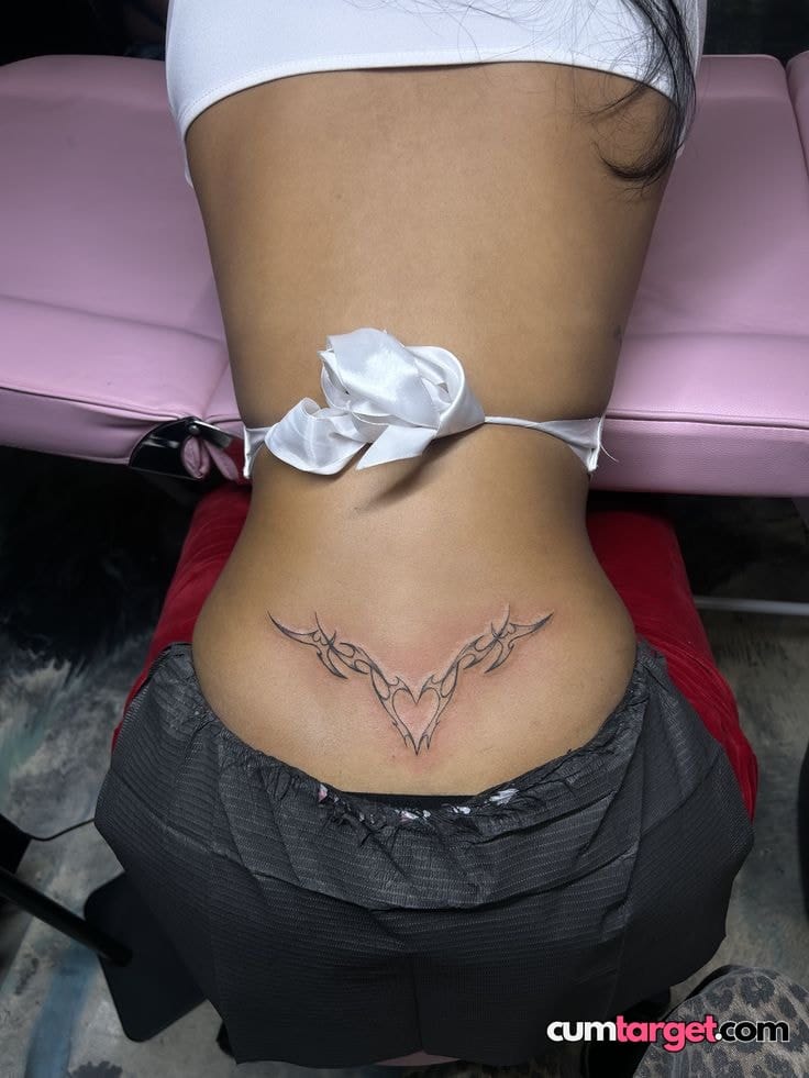 Cum On Lower Back Tribal Tattoo