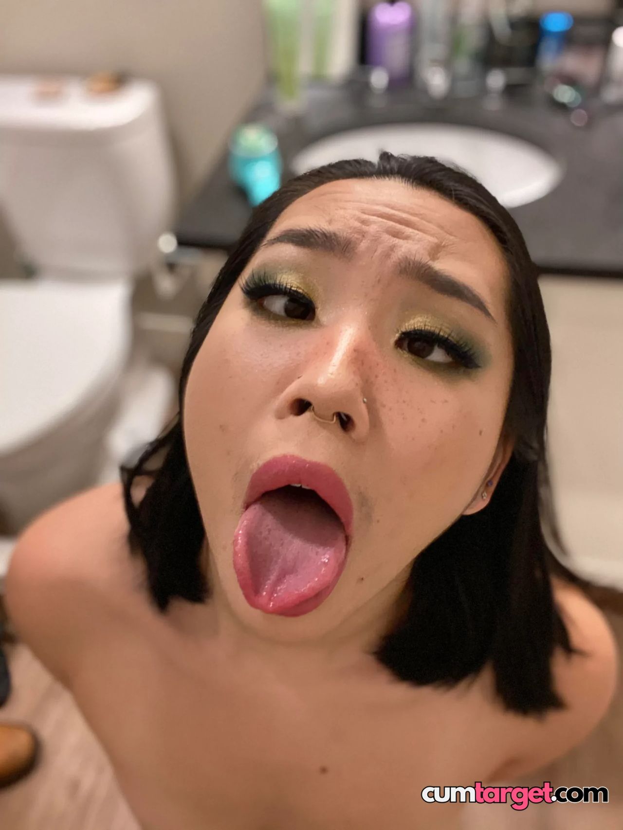 Spray on Woman Sticking Out Tongue