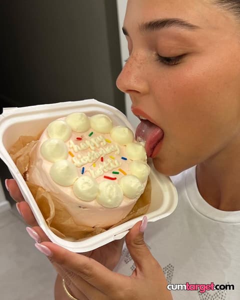 Spray on Woman Licking Birthday Cake