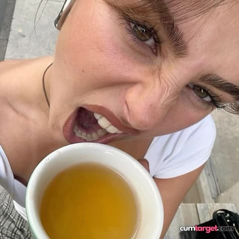 Spray on Woman About to Drink Tea