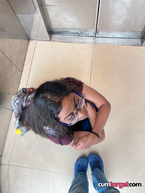 Target Woman Sitting on Floor in Elevator