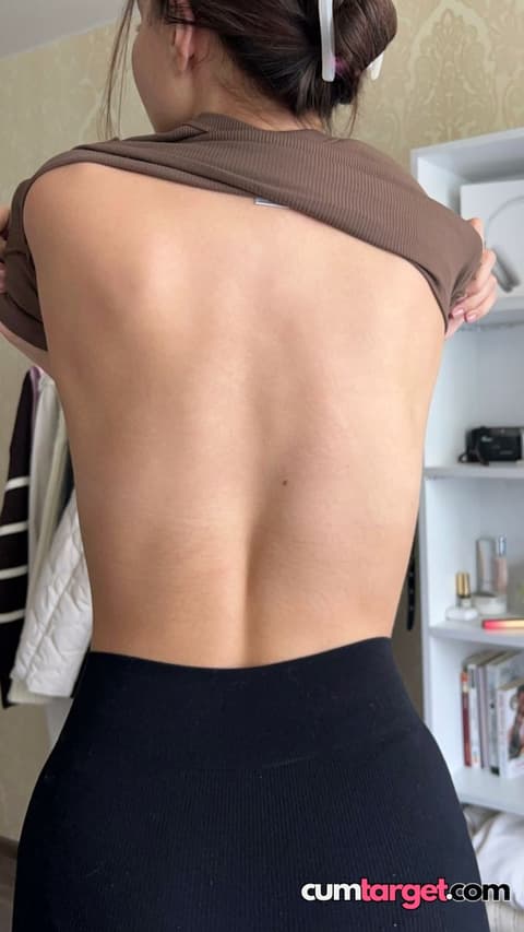 Spray on Woman Lifting Shirt Showing Back