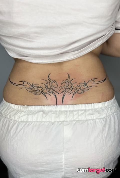 Waiting for Cum Lower Back Tribal Tattoo