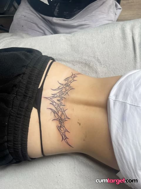 Waiting for Cum Tribal Tattoo on Lower Back