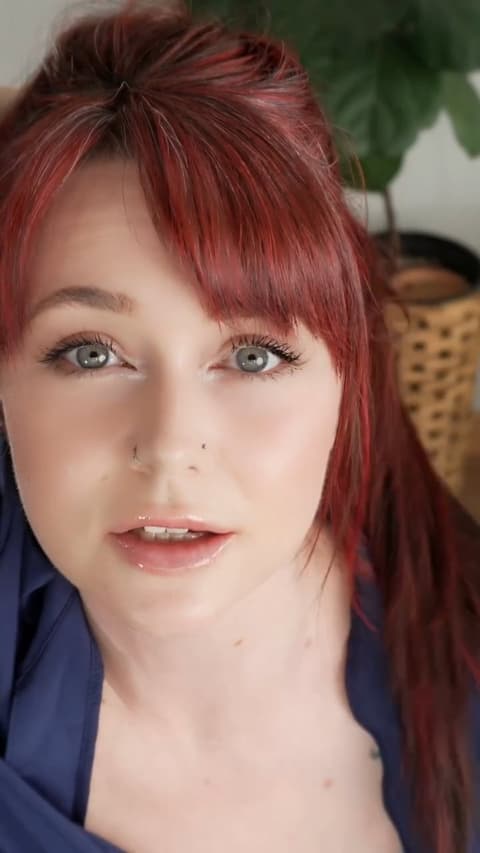 Spray on Close-up of Woman with Red Hair