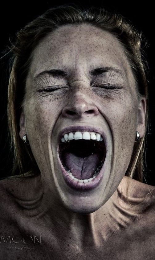 Woman Screaming in Dark