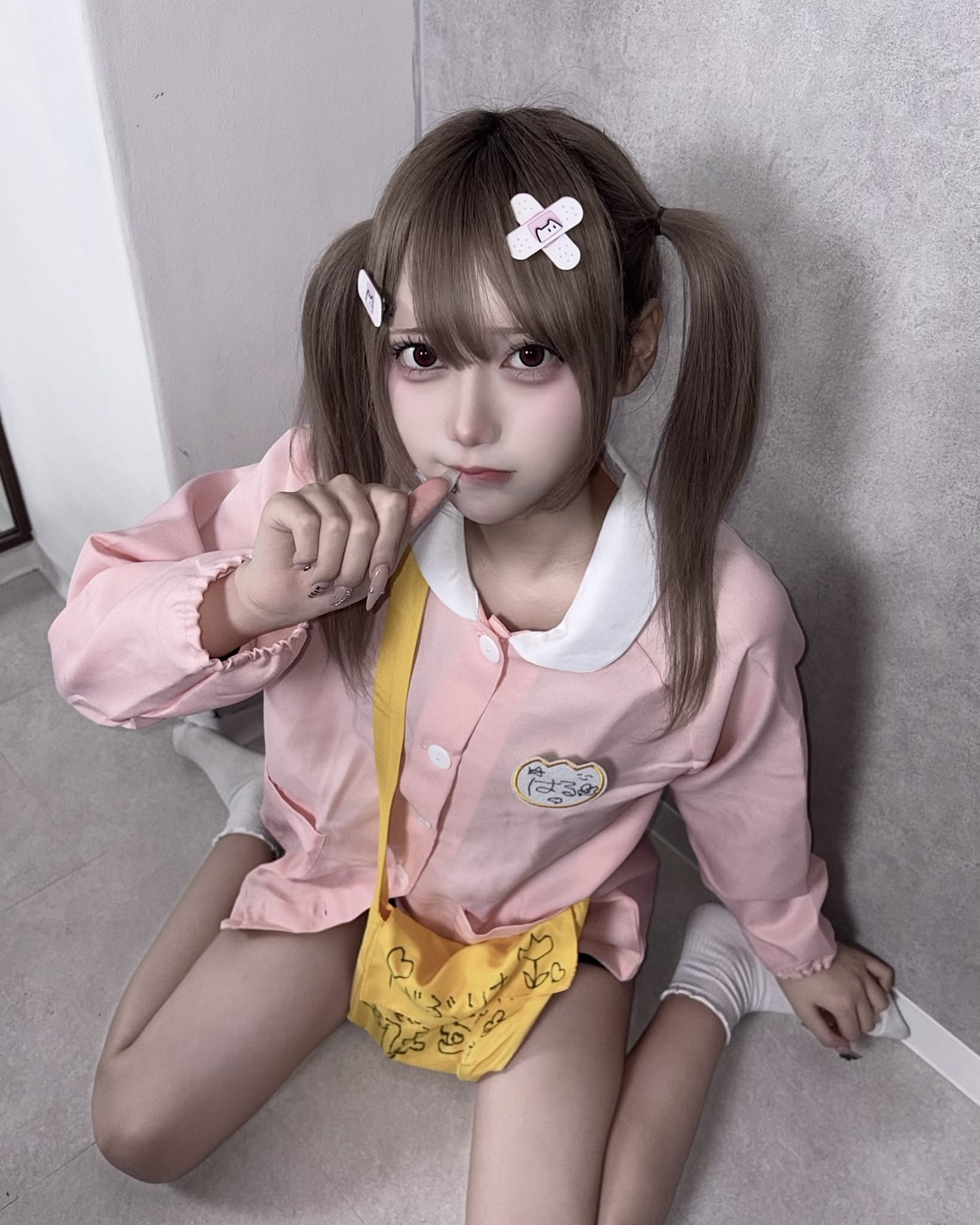 Girl in Pink Outfit Sitting