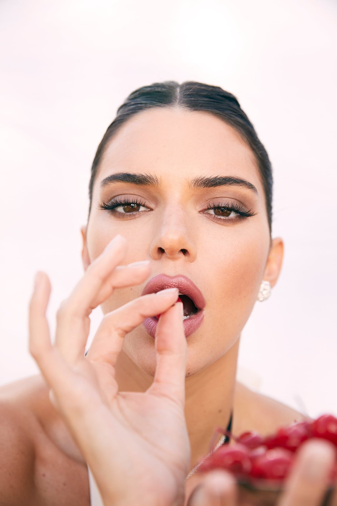 Woman Eating Pomegranate Seeds