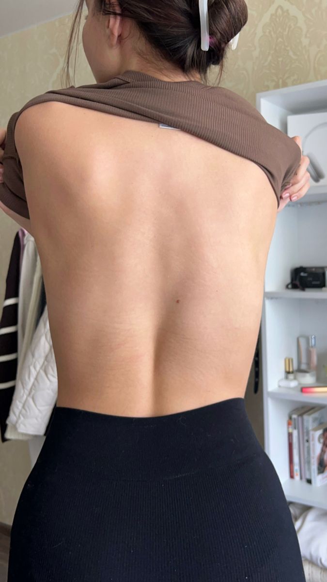Woman Lifting Shirt Showing Back