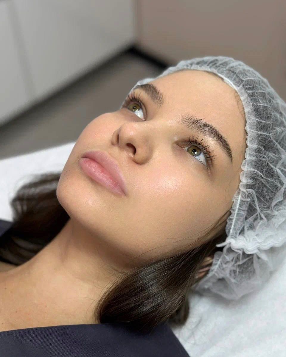 Woman Relaxing in Medical Cap