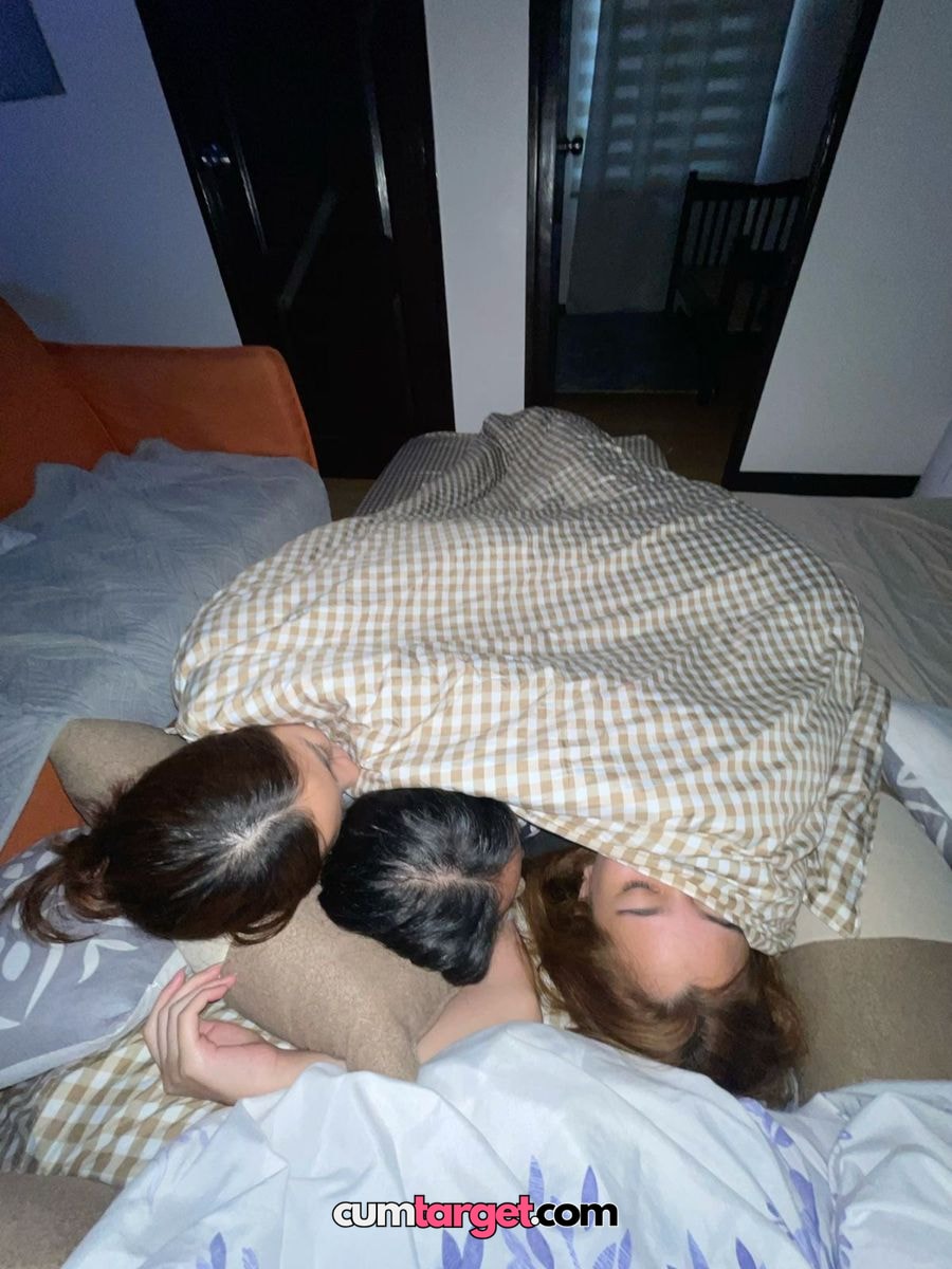 Spray on Spray on Three People Cuddling Under Blanket