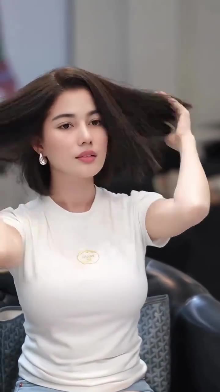 Woman Adjusting Hair
